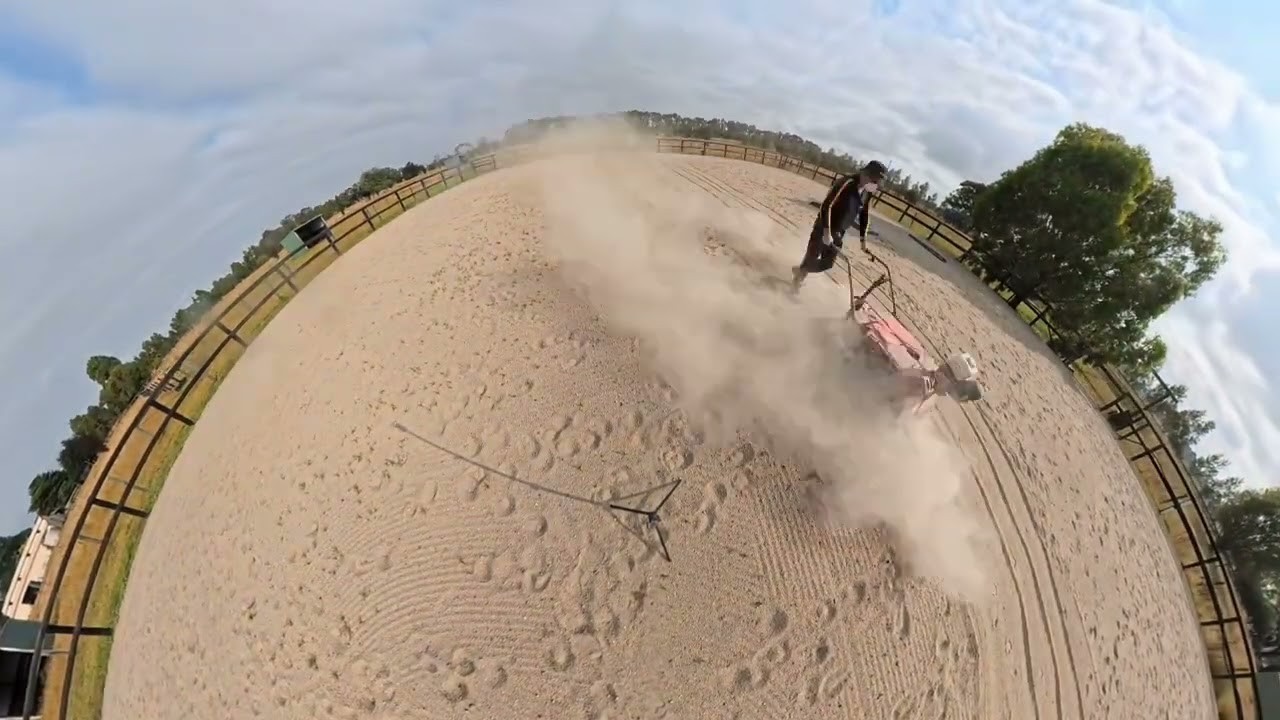 Horse arena cleaning machine in action